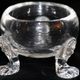 An English crystal salt cellar from circa 1720, embellished with three lion heads.