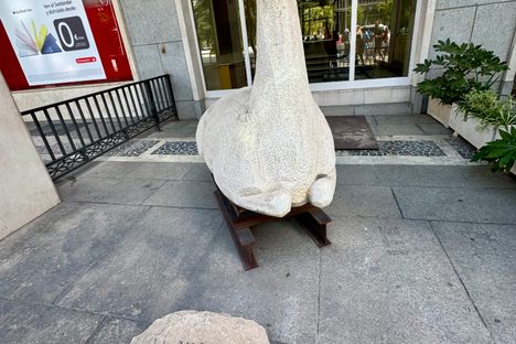 With the stone that names the sculptor