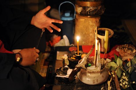 A Malay bomoh, or medium with the paraphernalia he uses to treat illnesses. The occult is popular in Malaysia, despite Islamic prohibitions against it. 