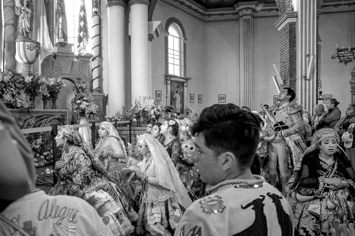 At the end of the entrada, dancers kneel to implore the Virgen del Socavón for her blessing. Milkmaids and a bullfighter are among the characters in the dance. 