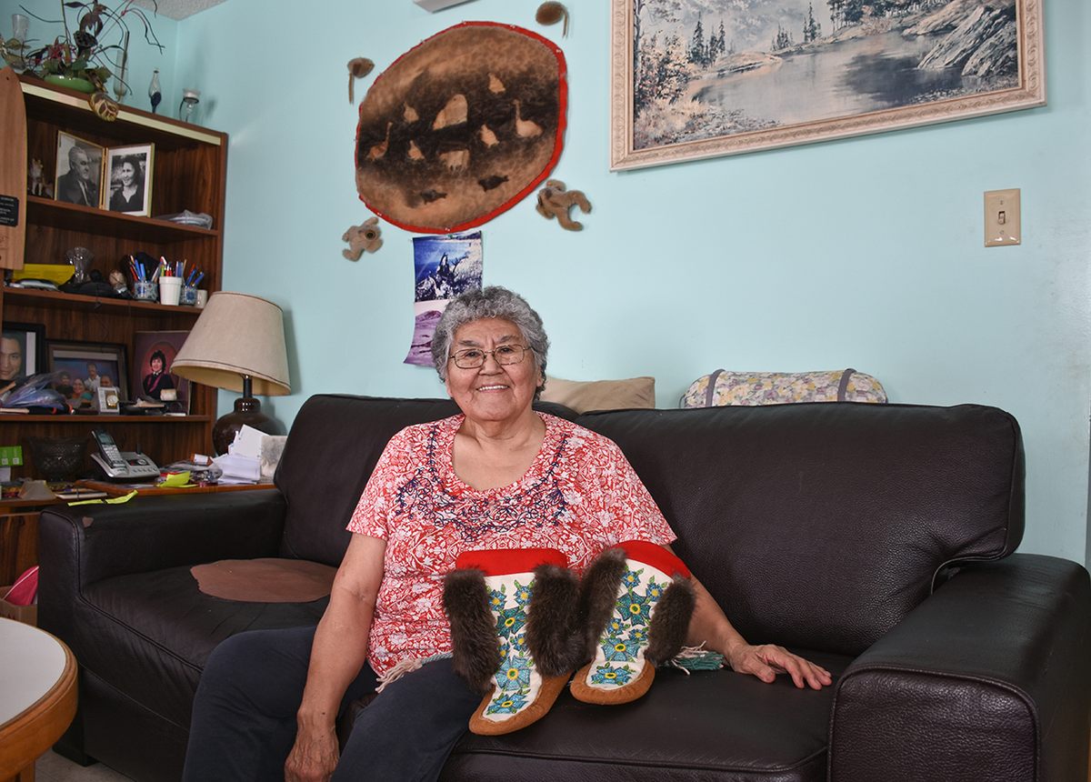 No ice road means no tourist trade—a blow to traditional artists like Annie Gordon, who peddles handmade wares to seasonal visitors.