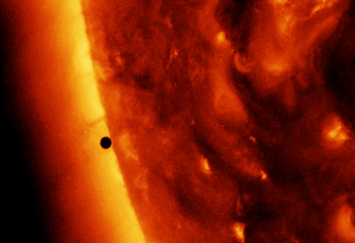 Mercury, an "empty little rock," appears as a small black dot as it crosses in front of the Sun.