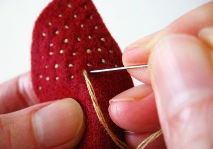 Stitches give strawberries a nubby, realistic texture.