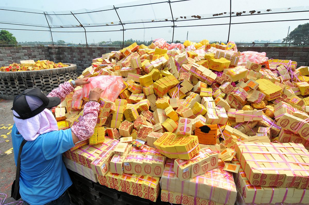 "Ghost money" piled up for Tomb Sweeping Day in Pingtung.