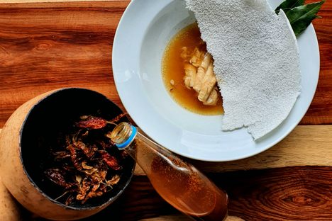 Matrinxã mujeca (a fish soup) with local chilis and chili sauce.