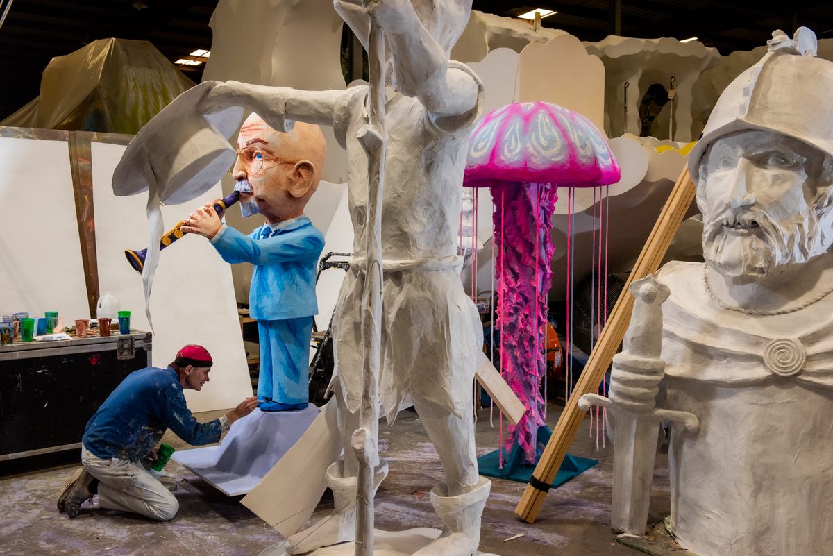 Artist Daniel Fuselier works on a prop for the house float honoring jazz musician Pete Fountain.