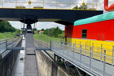 Between the two locomotives.