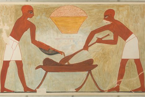 Two workers blend a tiger nut mixture for cakes in this painting from the tomb of a vizier. 