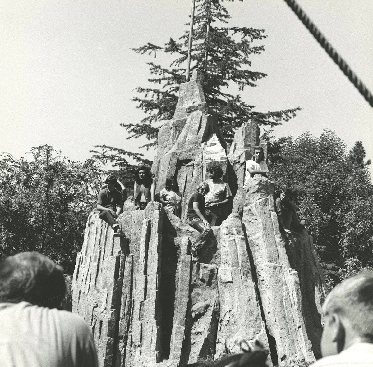 Yippies climb Castle Rock on Tom Sawyer Island.