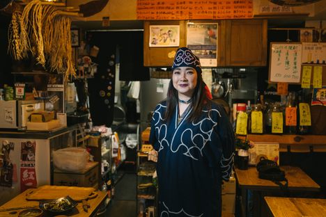 Teruyo Usa, owner and founder of Harukor, wearing Ainu robes.