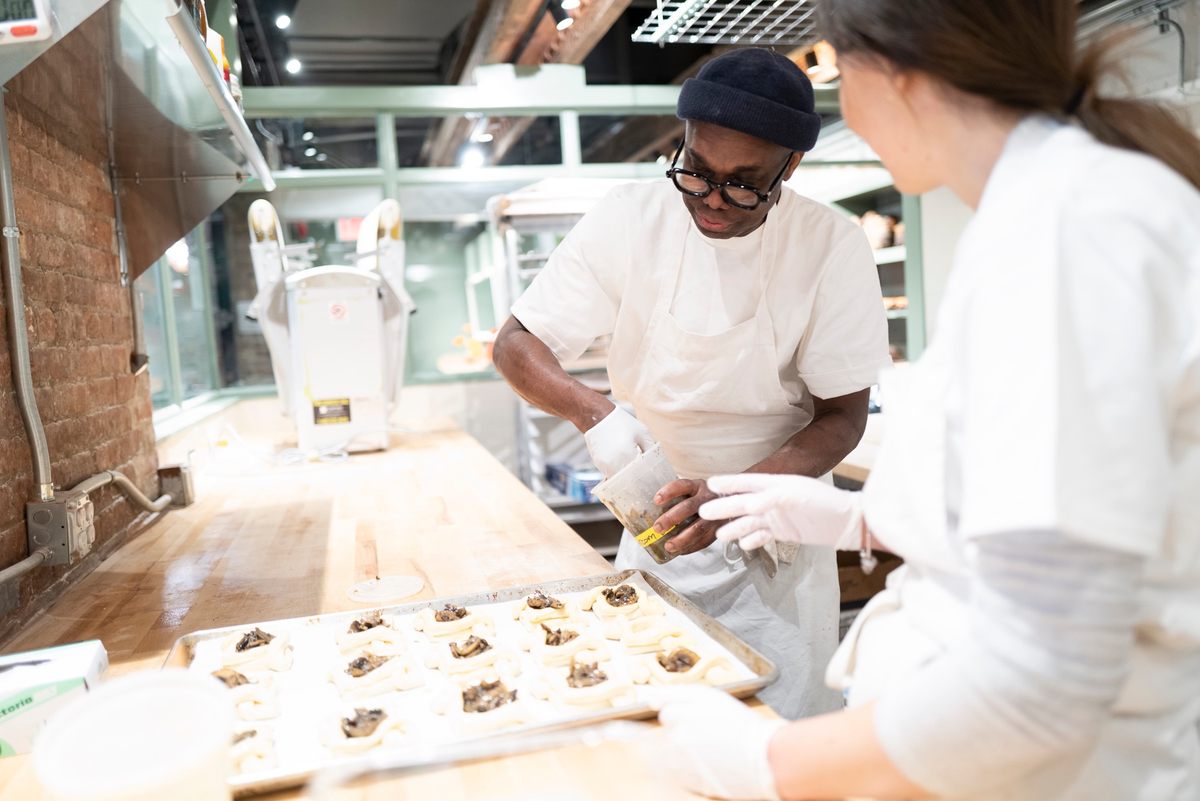 Amadou Ly filling savory danishes.