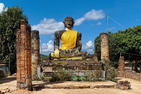 Buddha statue in the ruins of the bombed temple in Muang Khoun.