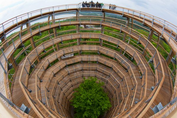 Visitors stand on a 130-foot-high spiral tower.