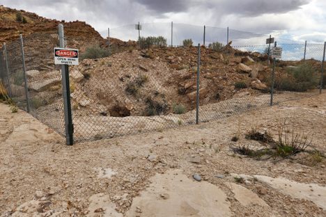 Chain-link fence around one of the open shafts.