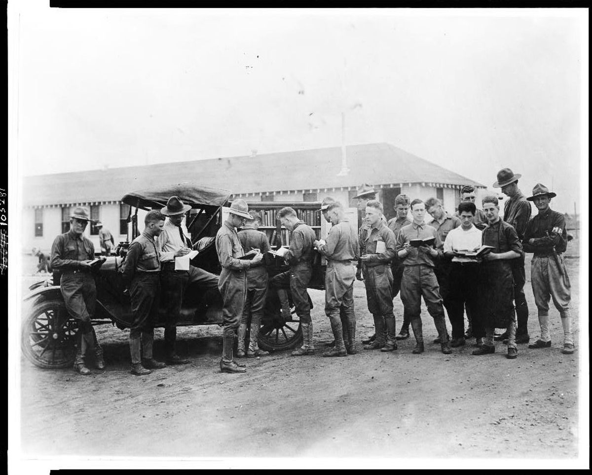 Soldiers getting library books from a truck, Kelly Field Library, Texas, c. 1917.