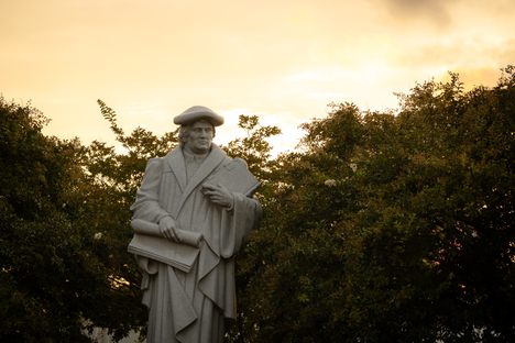 North America’s largest Martin Luther statue rises on a plaza between the chapel and student center at Lenoir-Rhyne University, framed by blooming crepe myrtle trees.