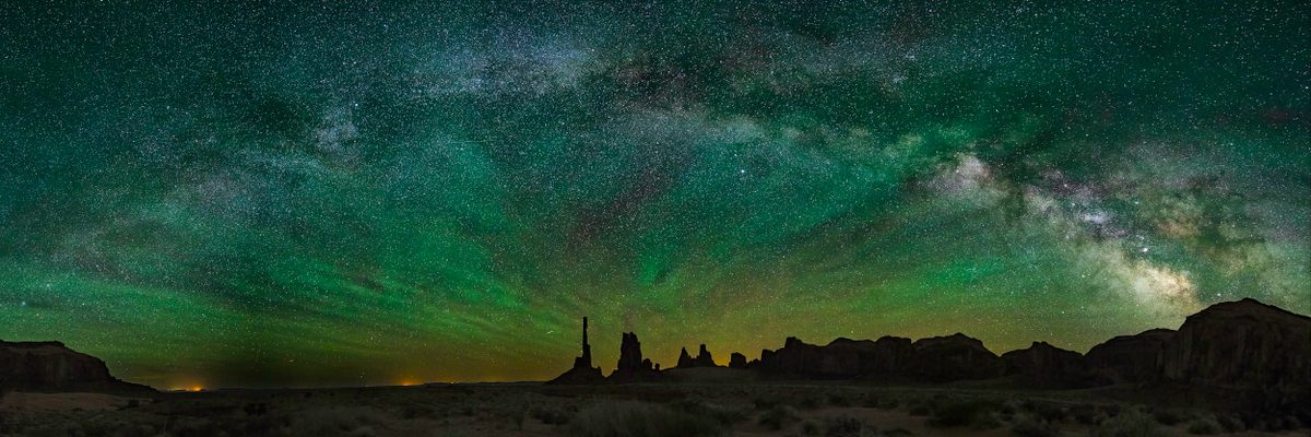 Jeanne Scott's photograph of the Milky Way over Monument Valley, Arizona, with green air glow.