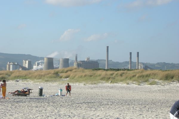 Spiagge Bianche with factories behind it