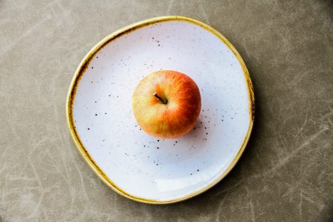 An apple pictured on a round plate at the Shangri-La Hotel in Singapore.