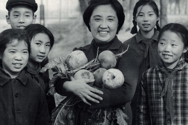 Chen with children in a radish field. 