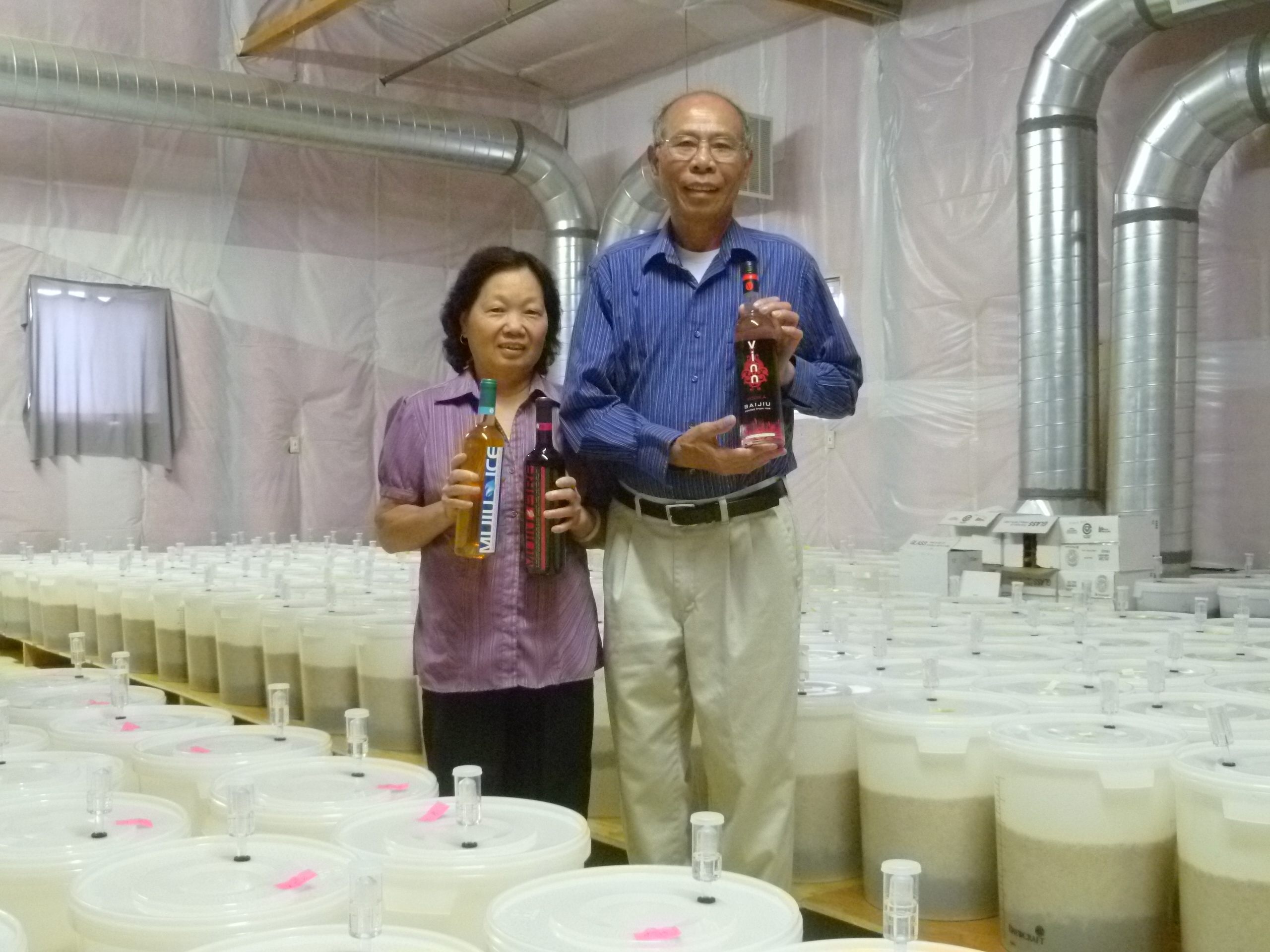 Kim Trinh and Phan Ly, with their baijiu.