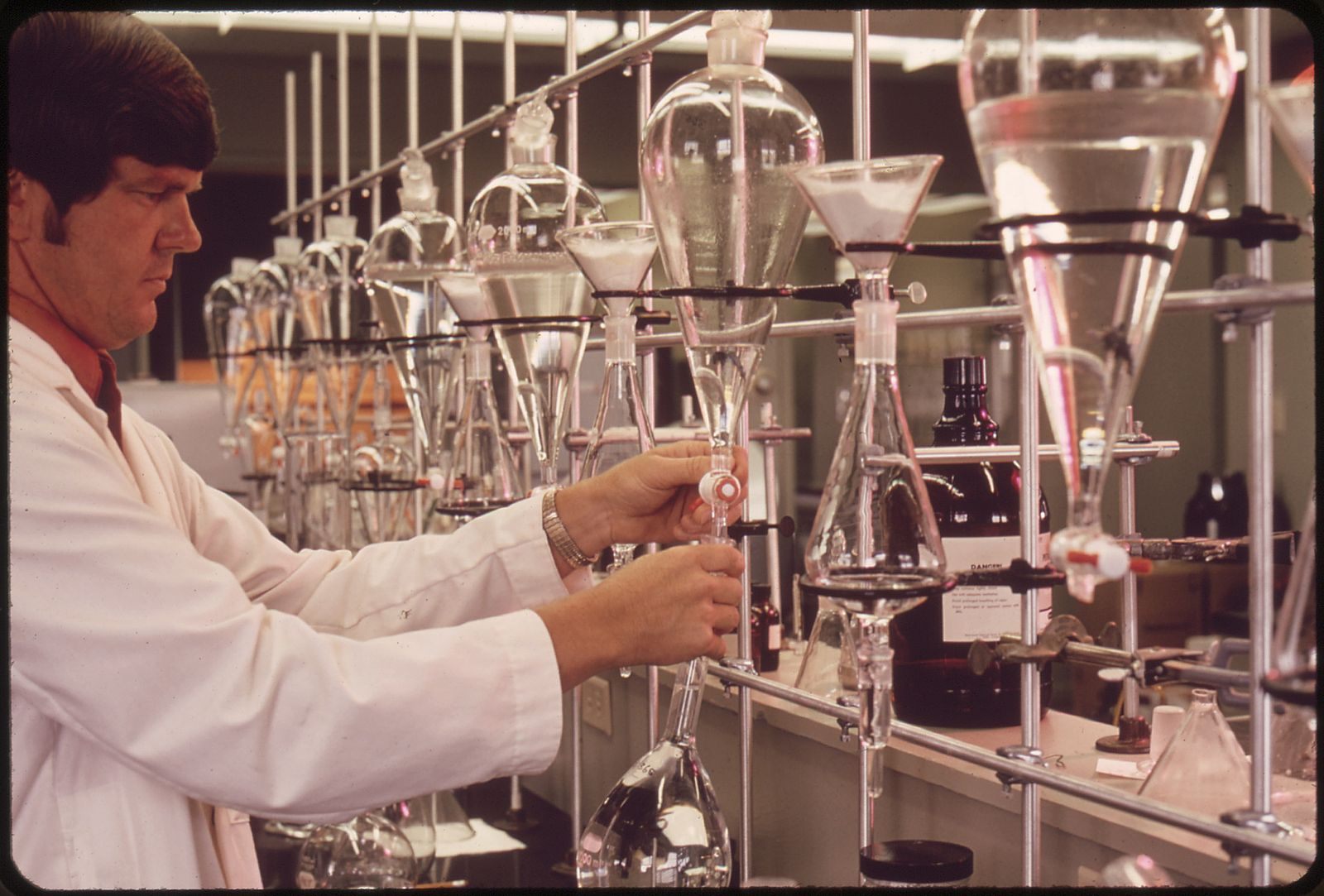 A 1970s-era chemistry setup, demonstrated by an EPA worker.