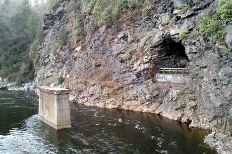 Abandoned bridge pylon and tunnel on old rail line parallel to the Lehigh Scenic Railway in the Lehigh Gorge