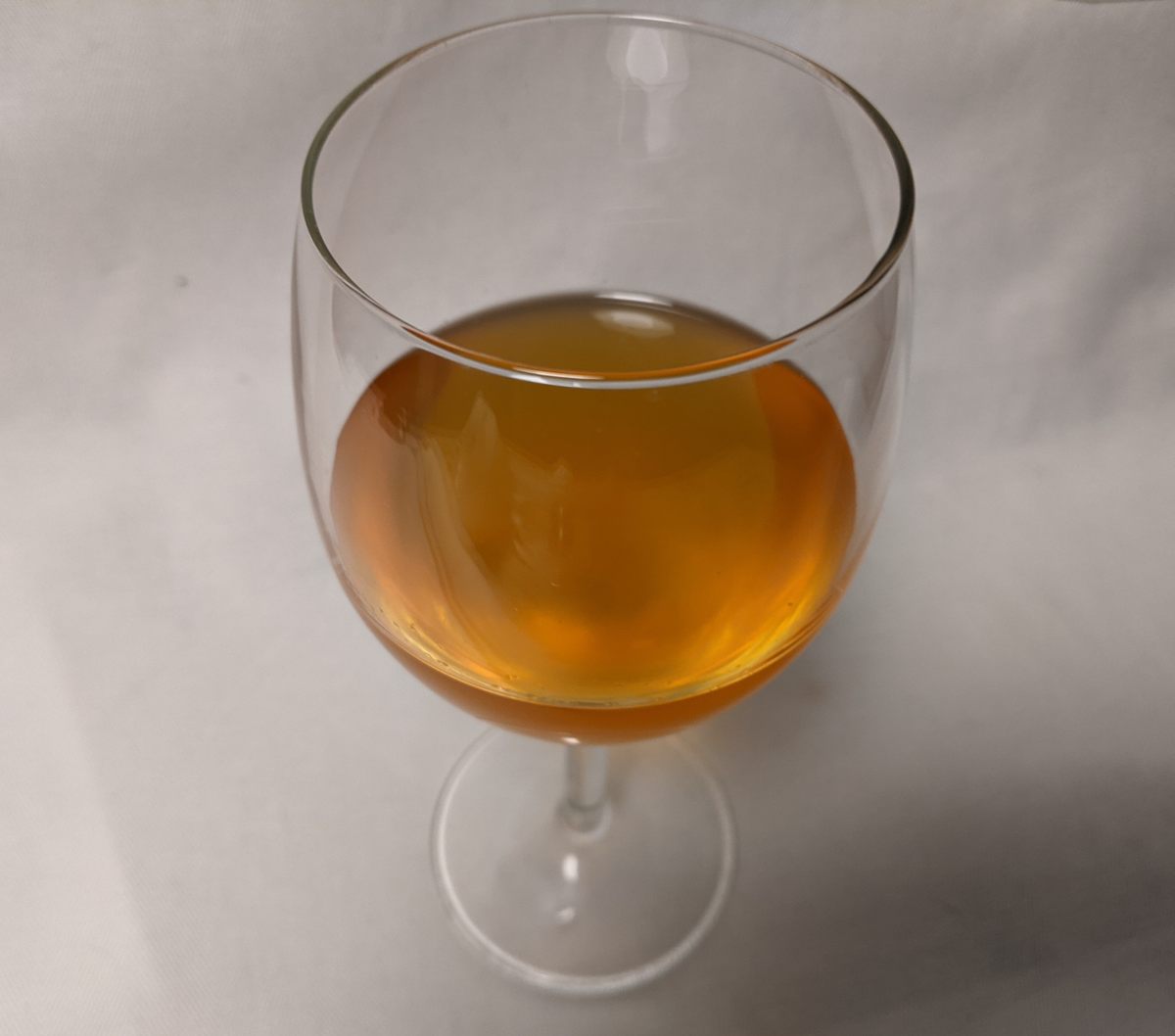 A sip of honey, caramel, and history in a glass of finished wild-ferment bochet.