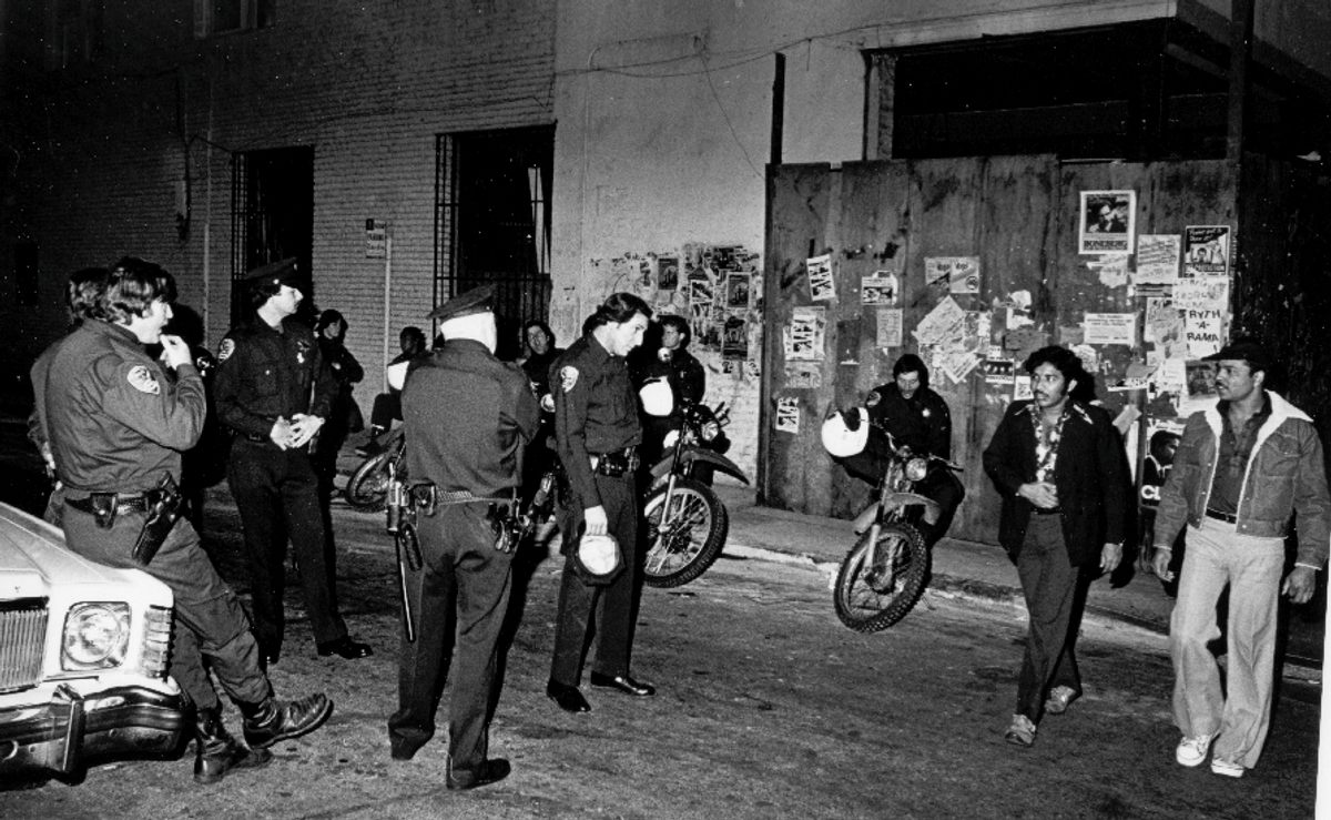 Police presence was always a feature of the celebrations, whether benevolent or confrontational, as seen here on Halloween 1980 on Polk Street.