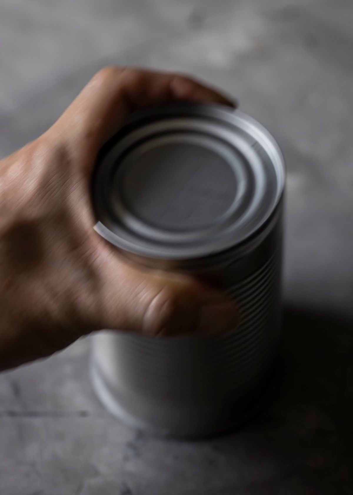 To open a can purchased from the commissary, masak cooks would shave the rim off against the concrete floor before slamming it down to remove the lid.