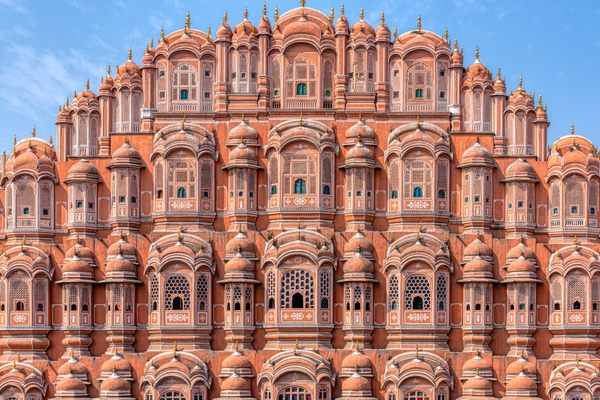 Sir Edwin Arnold thought Hawa Mahal was "a vision of daring and dainty loveliness, of storeys of rosy masonry and delicate overhanging balconies and latticed windows. Soaring with tier after tier of fanciful architecture in a pyramidal form, a very mountain of airy and audacious beauty through the thousand pierced screens and gilded arches of which the Indian air blows cool over the flat roofs of the very highest house." As quoted in, Delhi Agra Jaipur, by Surendra Sahai.  See more at https://kimcarpenterphotos.smugmug.com/Hawa-Mahal-Jaipur-India/.