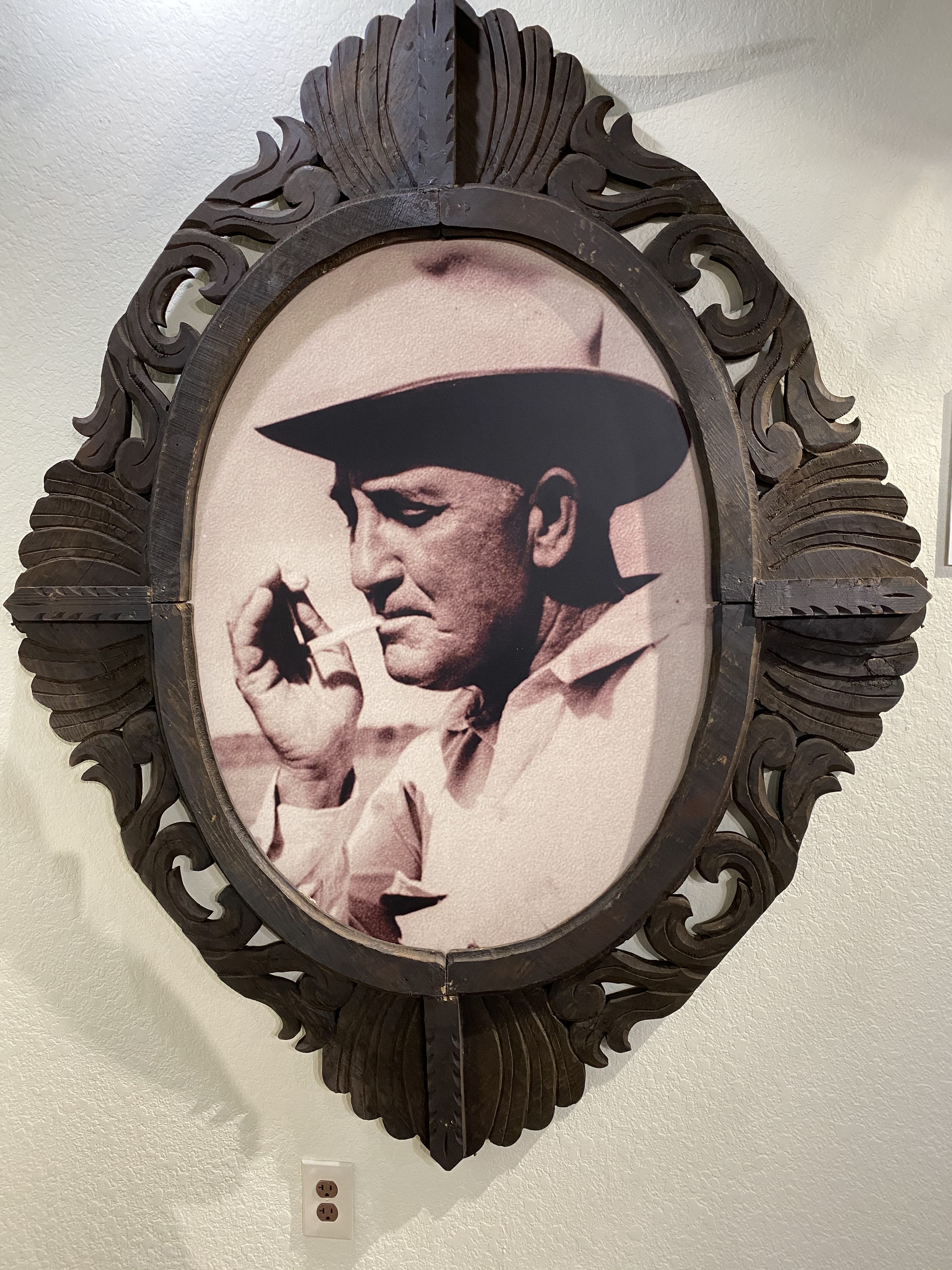 A portrait of Milby Butler, cowboy hat and all.