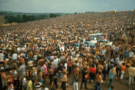 The crowd was much, much bigger than expected, which helped turn a music festival into the stuff of legend. 