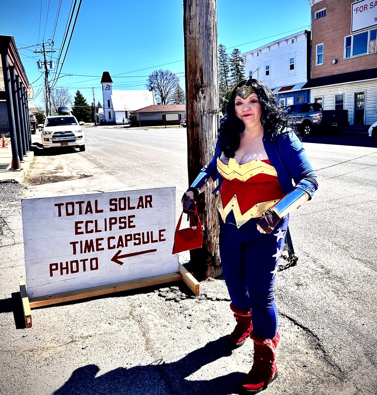 At the eclipse time capsule event in Norfolk, New York, Wonder Woman gets ready for her close-up.