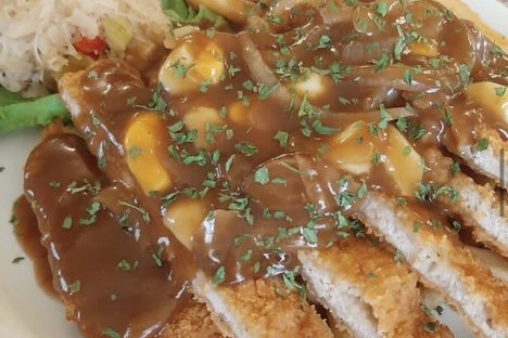 This German version of poutine includes pork tenderloin, gravy, and fries.