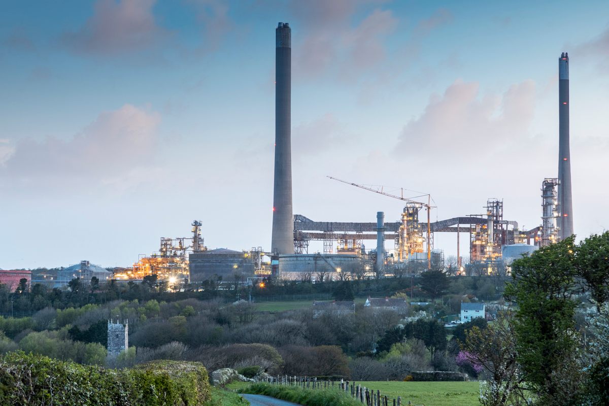 St. Decuman’s in the Welsh village of Rhoscrowther, Pembrokeshire, stands in the shadow of an oil refinery. A 1994 explosion at the plant did significant damage to the church's roof.