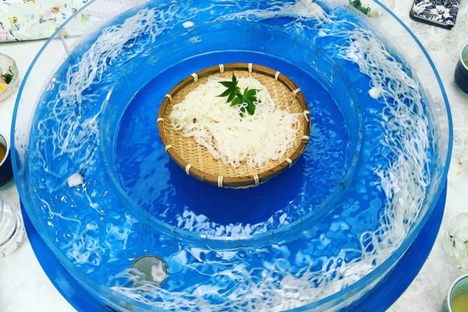 A spinning, circular basin of nagashi somen.