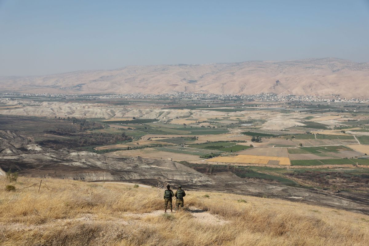 Israeli soldiers stand guard at a military outpost overlooking the Jordan Valley, between the Israeli city of Beit Shean and the West Bank city of Jericho, in 2019.