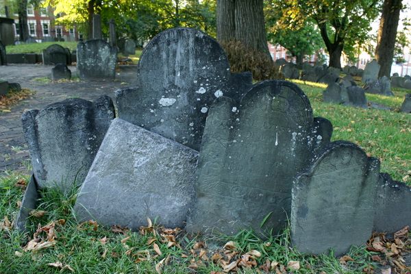 Many of the gravestones appear to be sinking into the ground