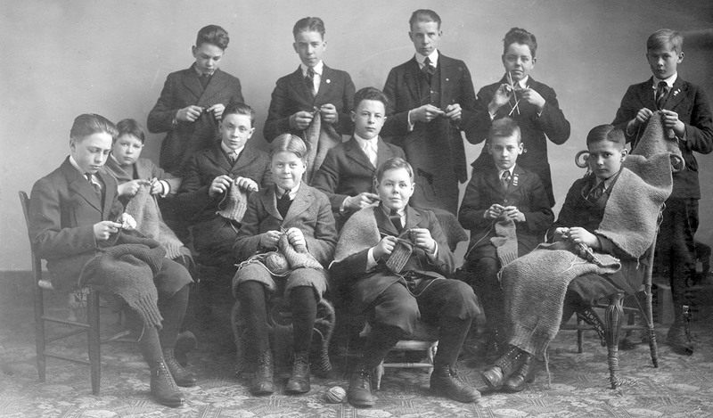 High school boys knitting for the soldiers during World War I, 1918, from <em>People Knitting: A Century of Photographs</em>