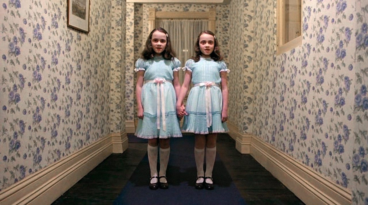 The Grady sisters, from Stanley Kubrick's <em>The Shining</em>, played by Lisa and Louise Burns, are among the most iconic pop culture twins. 