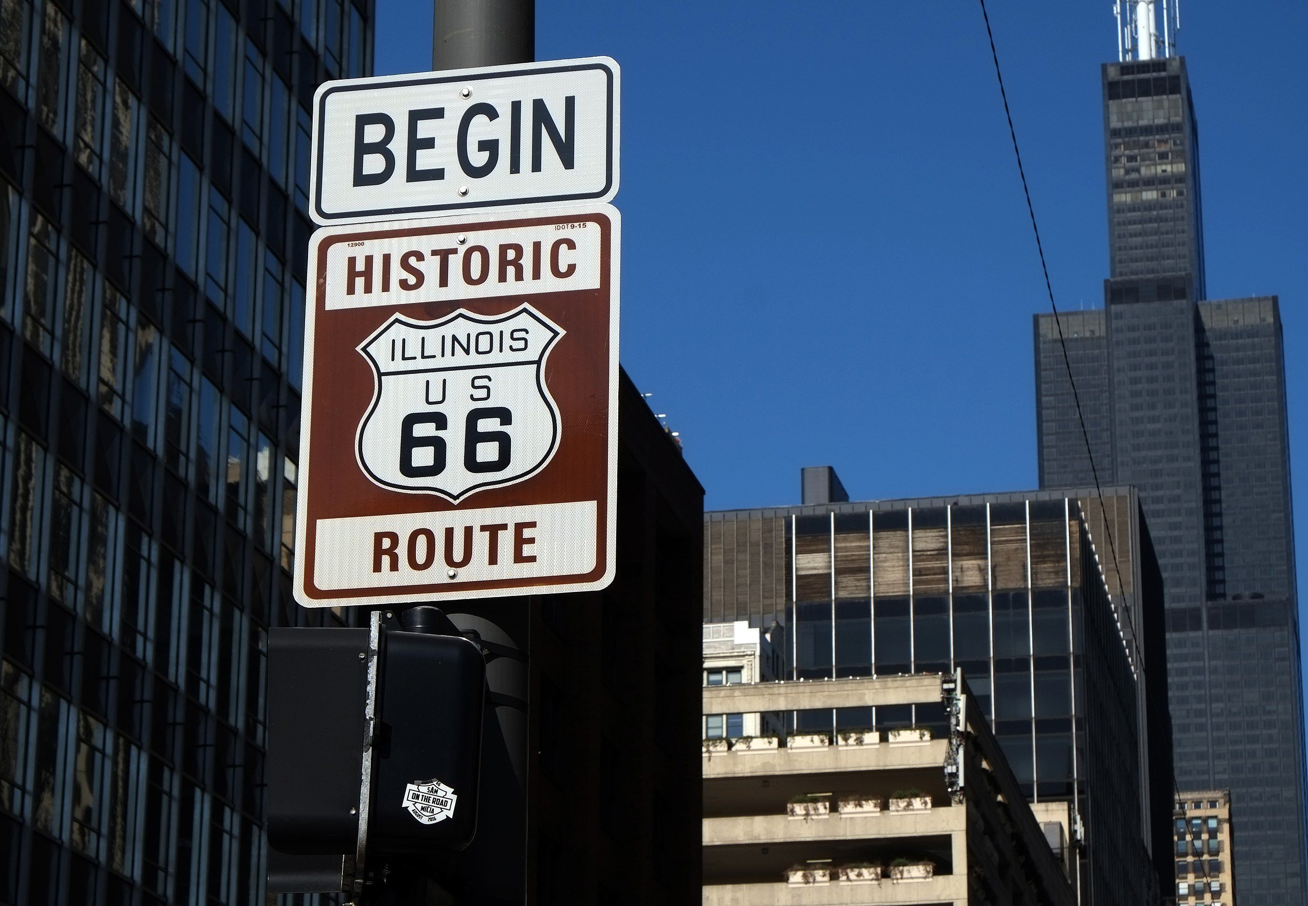 A sign marking the beginning of historic Route 66 in Chicago.