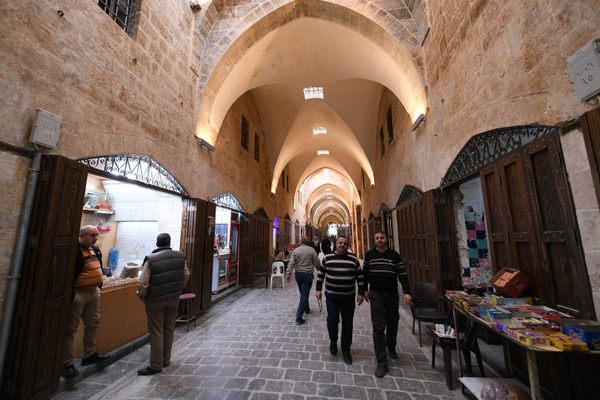 Shoppers visit the restored Souk al-Saqatiya in Aleppo, Syria, in November 2019. 