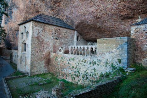 The structure is carved into the cliff