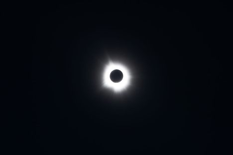 The sun's corona blazes into view during totality, the brief window when the moon fully blocks the sun, seen here during the April 2024 total solar eclipse.
