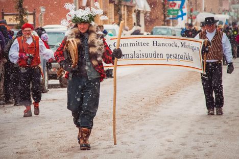 Adam Johnson (center) dresses up as Heikki Lunta as part of the Upper Peninsula's Heikinpäivä festival in Hancock, Michigan.