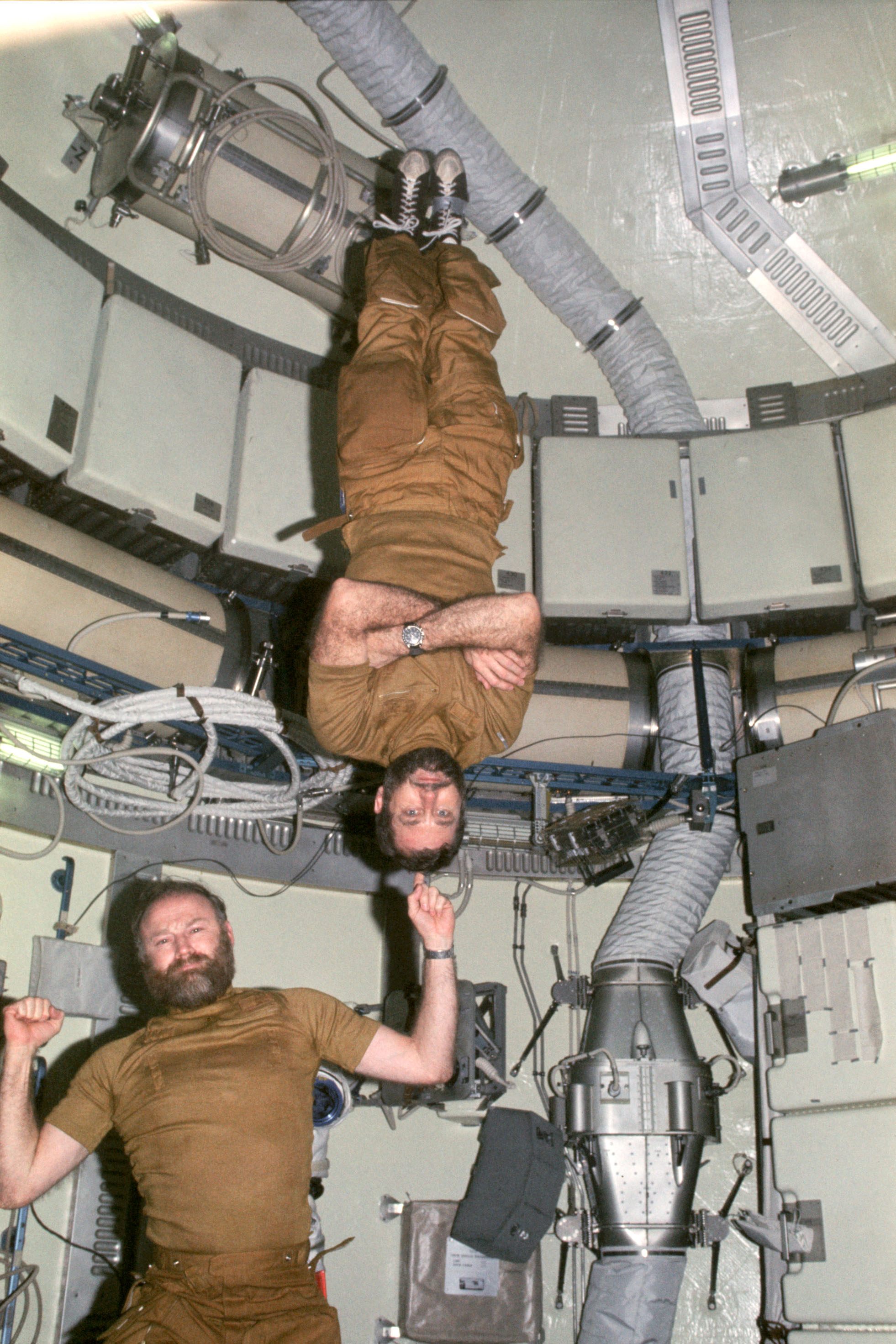 Carr holds up Pogue, with some zero-G help. Beards are again on full display.