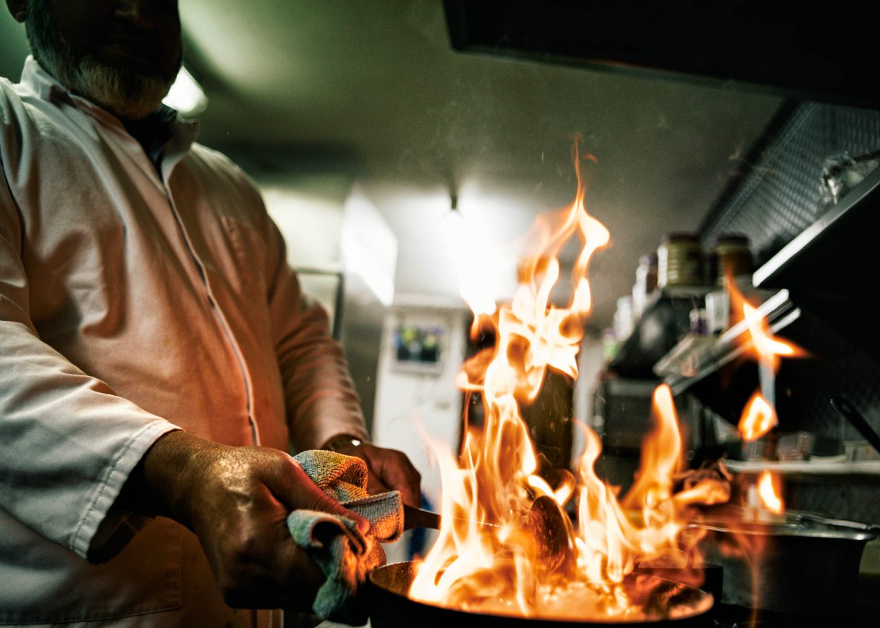 The Balti is cooked traditionally over scorching heat, which contributes to the speedy cooking process and allows for excess oil to burn off. Here, the Balti is cooked at Al Frash Balti House in Birmingham.