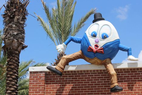 Humpty Dumpty sits on the wall above the patio at Ulele.