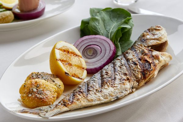 Charred local cipura (branzino) needs nothing more than a squeeze of lemon.